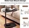 A side table next to a sofa, with illustrative graphics showing its placement and features. Produktbild-Vorschau
