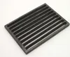 A dark gray, rectangular grate with multiple parallel slots is shown on a white background. Podgląd zdjęcia produktu