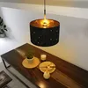 A dining table set with a pendant lamp hanging above. Anteprima dell’immagine prodotto