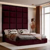 A plush burgundy bed with square upholstered headboard panels, dressed with striped pillows and a draped throw blanket. Anteprima dell’immagine prodotto