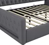 Close-up view of a gray upholstered bed frame with wooden slats. Náhľad obrázku produktu