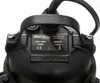 A close-up view of a black pump with a label showing specifications. Podgląd zdjęcia produktu