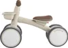 A side view of a beige and brown children's ride-on toy. Náhled obrázku produktu