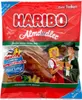 A bag of Haribo Almdudler gummy candies, featuring traditional Bavarian-style figures on the packaging. Podgląd zdjęcia produktu