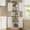 A white corner cabinet with wooden shelves is shown in a kitchen setting, next to a window with blinds. Podgląd zdjęcia produktu