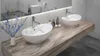 A modern bathroom with a double vanity featuring two vessel sinks on a wooden countertop. Náhled obrázku produktu