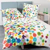 A bed with colorful bedding and pillows. Produktbild-Vorschau