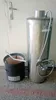 A stainless steel water heater with a shower head and faucet is shown next to a black cylindrical wood-burning stove with a metal handle. Produktbild-Vorschau