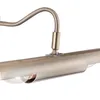 A close-up view of a picture light fixture, showing its metallic finish and a portion of the light bulb. Anteprima dell’immagine prodotto
