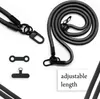 A black lanyard and accessories for a phone are displayed against a white background. Produktbild-Vorschau