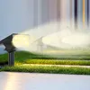 Solar-powered garden lights illuminating a lawn and pathway. Anteprima dell’immagine prodotto
