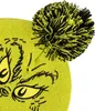 A close-up view of a lime green knitted hat with a black and yellow pom-pom and a Grinch face design. Podgląd zdjęcia produktu