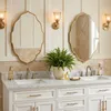 Miroir mural ovale doré avec bordure ondulée, idéal pour Voir les images du produit 3