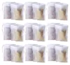A grid of tea filter bags, some filled with golden material and others with purple material. Produktbild-Vorschau