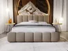A bedroom scene featuring a bed with a headboard and footboard, bedside tables, and decorative elements. Produktbild-Vorschau