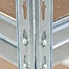 Close-up of a metal shelving unit with particle board shelves. Produktbild-Vorschau