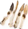 Four dried rabbit ears with fur, presented on a white background. Podgląd zdjęcia produktu