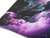 A close-up view of a gaming mousepad with an abstract nebula design. Náhľad obrázku produktu