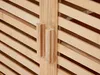 A close-up view of two wooden handles on a slatted wooden cabinet. Náhled obrázku produktu