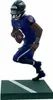 A figurine of a football player on a green base. Anteprima dell’immagine prodotto