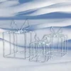 Three illuminated gift box decorations in the snow. Podgląd zdjęcia produktu