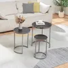 A living room setting with a sofa, rug, and a set of nesting tables. Anteprima dell’immagine prodotto