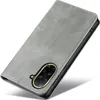 A gray flip cover phone case is shown diagonally against a white background. Produktbild-Vorschau