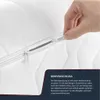 A hand is shown closing a zipper on a white mattress cover. Produktbild-Vorschau