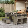 An outdoor patio setting with a rattan dining set, grill, and wooden fence. Produktbild-Vorschau