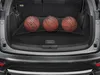 The trunk of a car with a cargo net holding three basketballs. Voir les images du produit