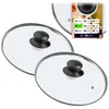Two glass pot lids with black handles are shown, with a marketing graphic in the upper right corner displaying size options. Voir les images du produit