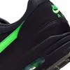 A close-up view of the side of a black Nike Air Max sneaker with green accents. Produktbild-Vorschau