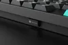 Close-up of a black keyboard with a small rectangular logo on the side. Produktbild-Vorschau