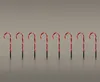 A line of eight illuminated candy cane lawn decorations. Voir les images du produit