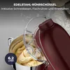 A close-up view of a red stand mixer bowl filled with batter, with text overlays describing its features. Produktbild-Vorschau