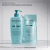 A bottle and a refill pouch of Kérastase shampoo are displayed on a white surface with a light gray background. Náhled obrázku produktu