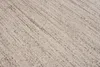 A close-up, textured view of a carpet with a woven pattern. Náhľad obrázku produktu