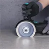 A close-up shot of a power tool cutting a line into a surface. Anteprima dell’immagine prodotto