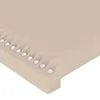 A close-up view of the edge of a beige upholstered surface with decorative studs. Produktbild-Vorschau