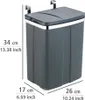 A gray trash can with a lid, designed to hang on a cabinet door, with dimensions indicated. Anteprima dell’immagine prodotto