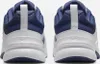 The back view of two white and blue Nike sneakers. Voir les images du produit