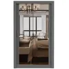 A mirrored sliding door wardrobe reflected in a bedroom. Voir les images du produit