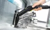 A hand uses a steam cleaner to clean a kitchen faucet. Anteprima dell’immagine prodotto