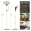 A collage of images showing a floor-standing infrared heater, its dimensions, and lifestyle shots of it being used on a terrace and balcony. Produktbild-Vorschau