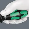 A close-up of a hand holding a screwdriver. Produktbild-Vorschau