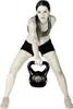 A woman is holding a kettlebell. Produktbild-Vorschau