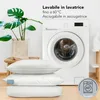 Three pillows are stacked on a floor in front of a washing machine. A potted plant is on a wooden stool to the left. Anteprima dell’immagine prodotto