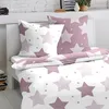 A bed with bedding featuring a star pattern. Produktbild-Vorschau