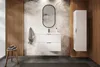 A modern bathroom vanity with drawers and a cabinet, set against a botanical-patterned wallpaper and slatted wood paneling. Náhľad obrázku produktu