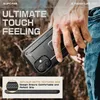 A hand holding a black phone case with a kickstand in an outdoor, natural setting. Produktbild-Vorschau